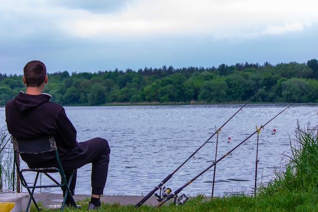 Closeup of a fishing rod wheel a man is fishing Nature