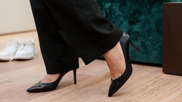 Photo closeup fitting of women's shoes in the store