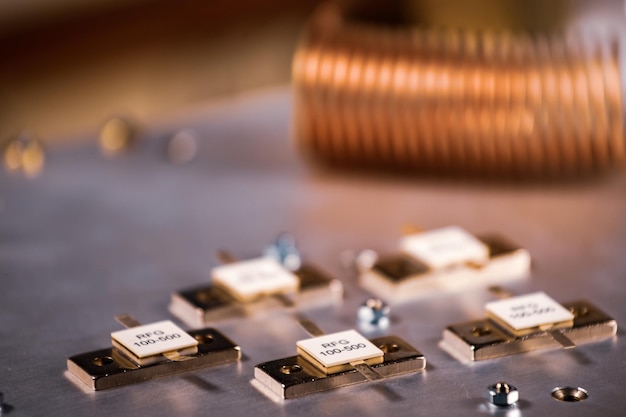 Closeup of five metal plates on a large iron case