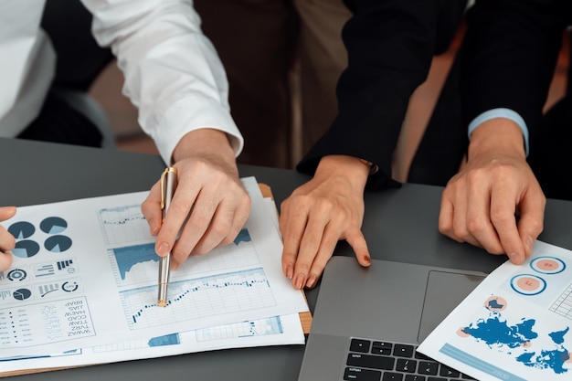 Closeup focus on BI dashboard with office worker in harmony office