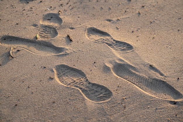 Closeup of footprints in the sand