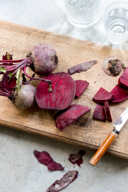 Closeup of fresh beet on wooden cut board