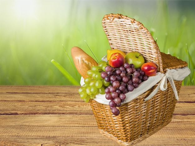 Closeup of fresh food in brown basket on nature background