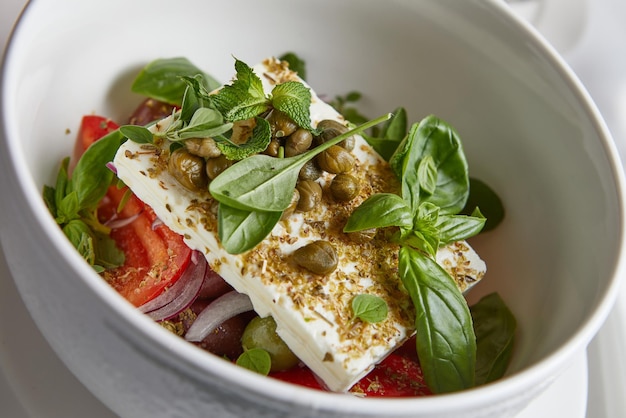 Closeup of fresh lettuce in a white deep plate