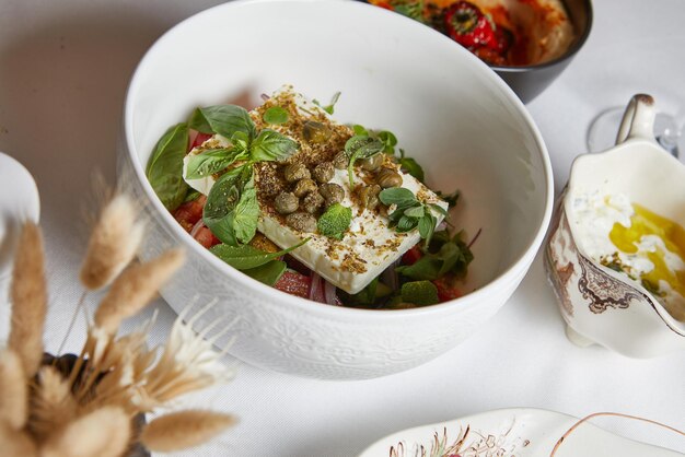 Closeup of fresh lettuce in a white deep plate