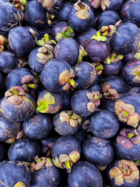 Closeup of Fresh ripe mangosteen fruits for sale in a supermarket