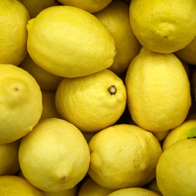 Photo closeup fresh yellow lemon background