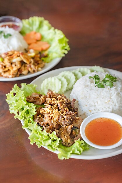 Closeup of  fried crispy pork served with spicy chili sauce