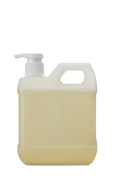 Closeup gallon bottle of yellow soap with refill  droper pump isolated on white background - coronavirus and covid-19 prevention concept