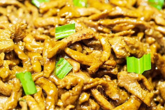 Closeup of Garlic Fried Pork background, thai street food market