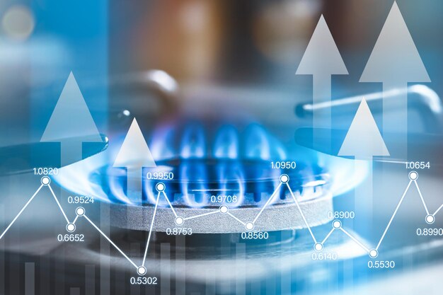 Крупный план газовой горелки и голограммы с данными о ценах на природный газ