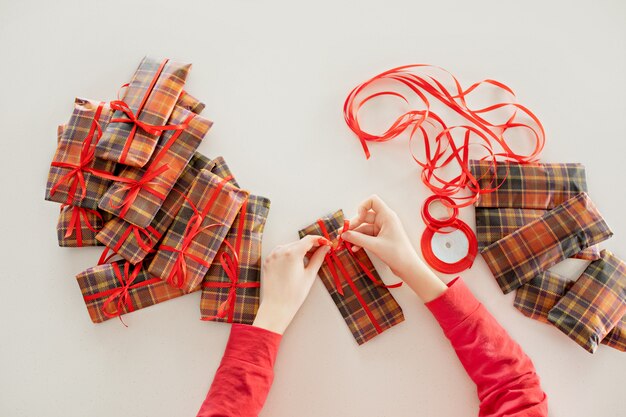 Closeup of a girl packing gifts