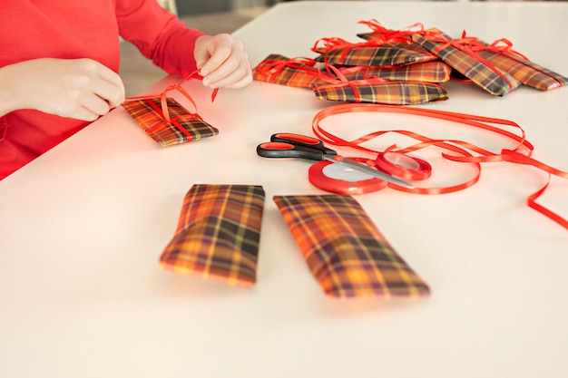 Closeup of a girl packing gifts