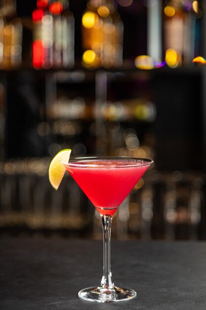 Closeup glass of cosmopolitan cocktail decorated and Cosmopolitan cocktail drink with lemon