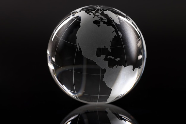 Closeup of glass globe on black background