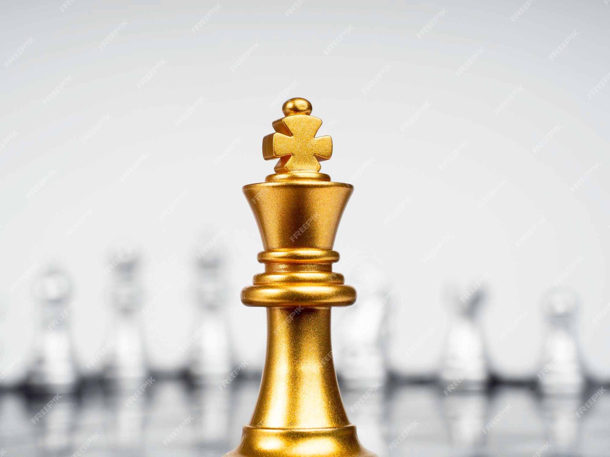 Premium Photo  Golden king chess standing with chess pieces lying