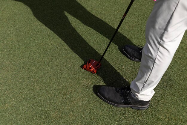 Closeup of a golfer39s legs holding a golf club