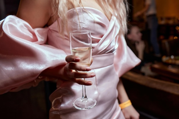 Closeup of gorgeous woman with a glass of champagne party and holiday celebration