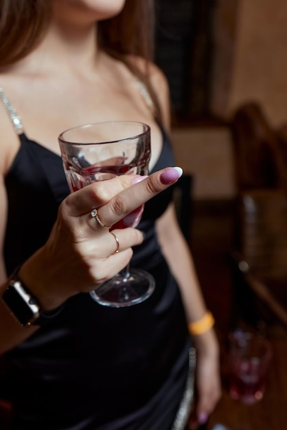 Closeup of gorgeous woman with a glass of champagne party and holiday celebration