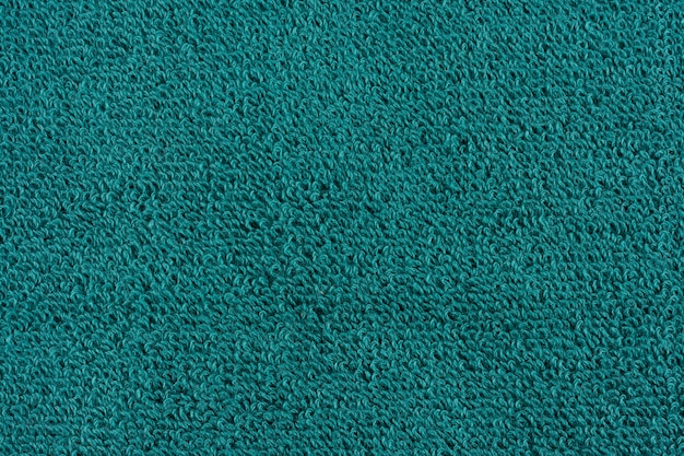 Closeup of a green towel. textile details backdrop.