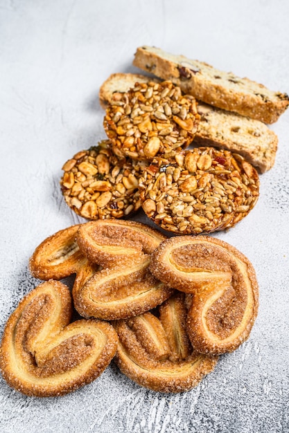 Closeup of a group of assorted cookies. White background. Top view.