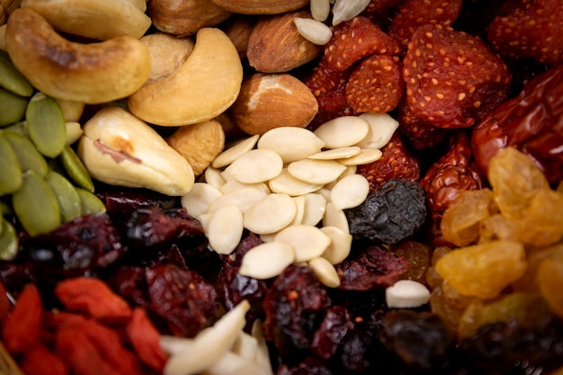 Photo closeup group of various types of whole grains and dried fruits.