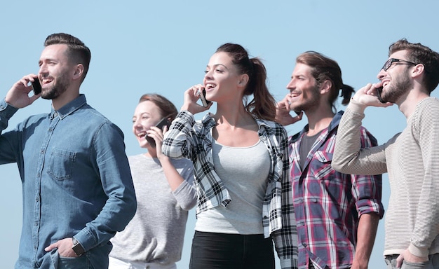 Closeup of a group of young people with smartphones