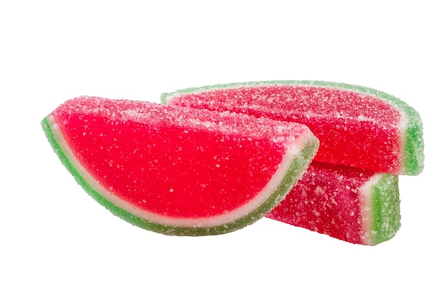 Closeup of gummy candies shaped like watermelon slices isolated on white background Popular fruity chewing sweets