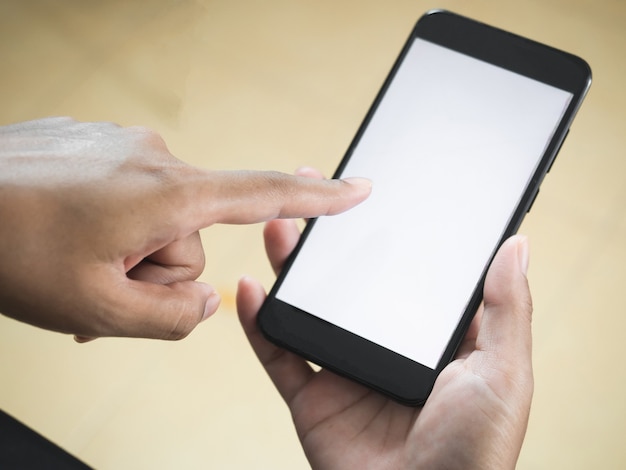 Closeup hand and finger of woman touch at mobile phone white screenWoman hand playing social media