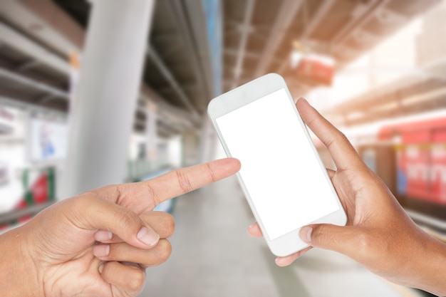 Closeup of hand holding modern smart phone with transportation urban