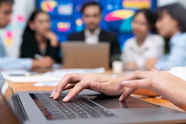 Closeup hand typing keyboard laptop with blurred background meticulous