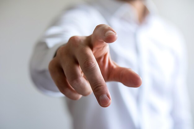closeup of hand with extended index finger pointing