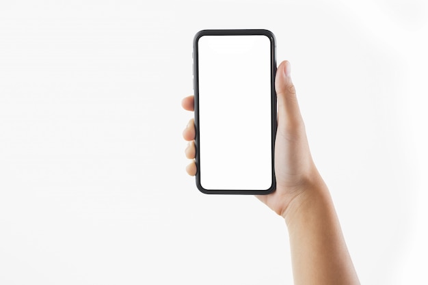 分離された黒いスマートフォン空白の画面を保持しているクローズアップ手女性
