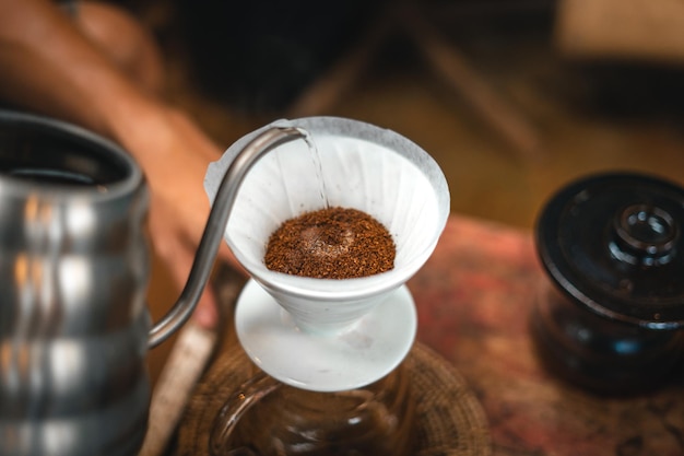 Closeup of hands barista make coffee