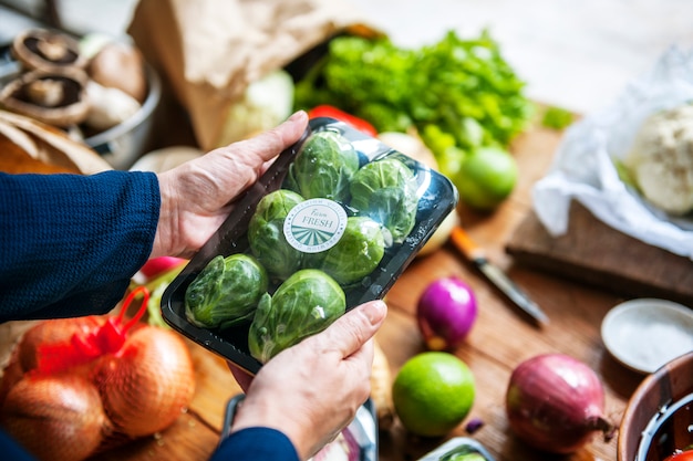 Closeup of hands holding brussels sprouts