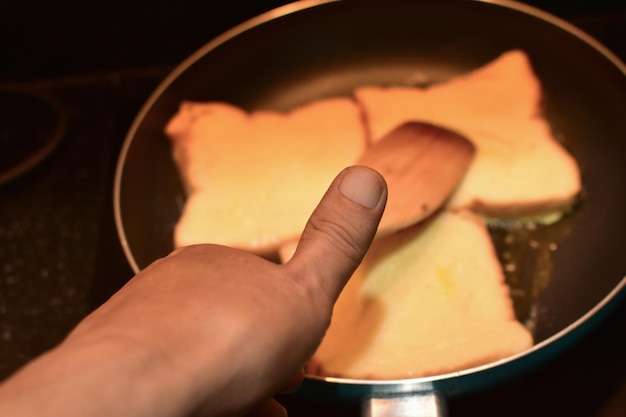 Closeup of hands holding food and eating