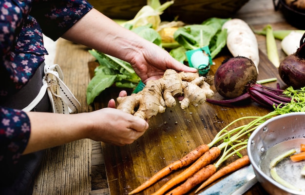 Closeup of hands holding fresh organic ginger