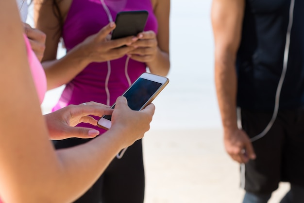 Closeup Of Hands Holding Modile Phones