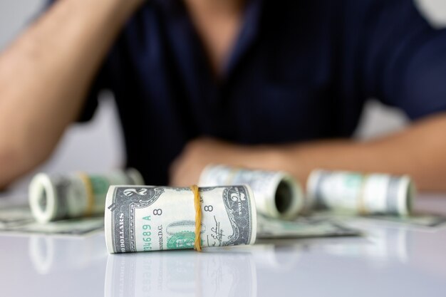 Photo closeup hands holding us dollar bills