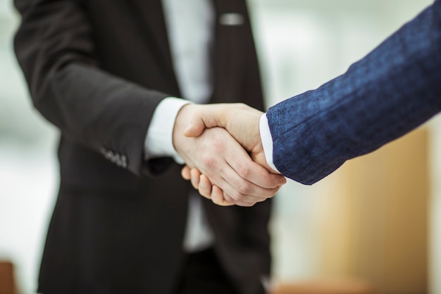 Closeup of handshake of business partners