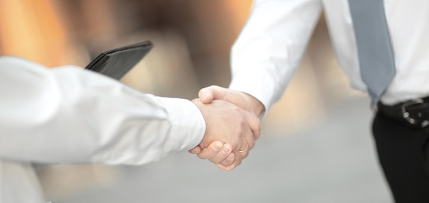 Closeup handshake business people in the office