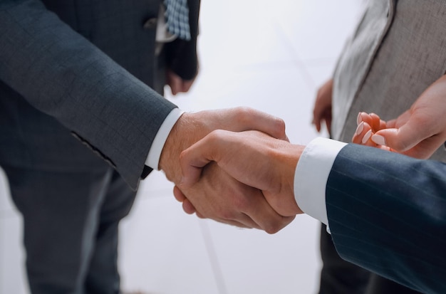 closeup.handshake of business people in office