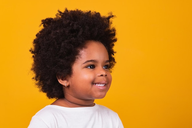 Closeup of happy little black girl smiling with space for text