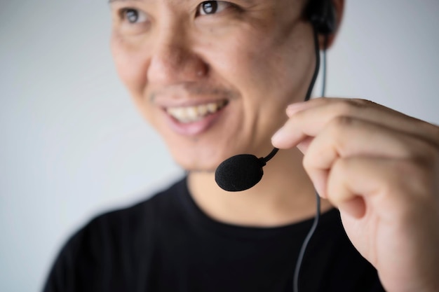 Closeup of happy telephone operators Service desk consultant talking on handsfree phone