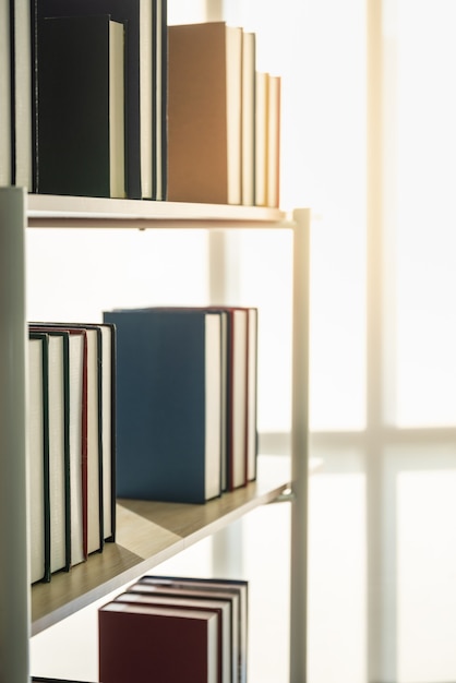 Closeup of hard cover books on shelf