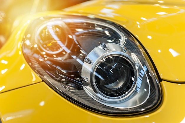 Closeup on an headlight of a sport car