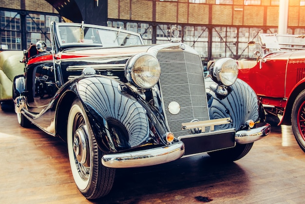 Closeup of the headlights and front bumper on vintage automobile