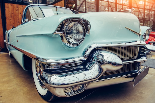 Closeup of the headlights and front bumper on  vintage automobile