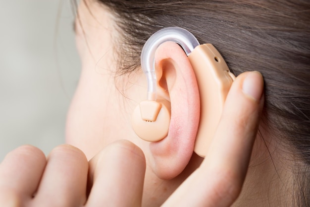 Closeup Of Hearing Aid In The Ear Of A Girl