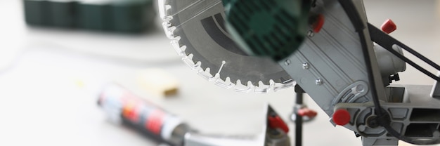 Closeup of high performance electric saw in workshop